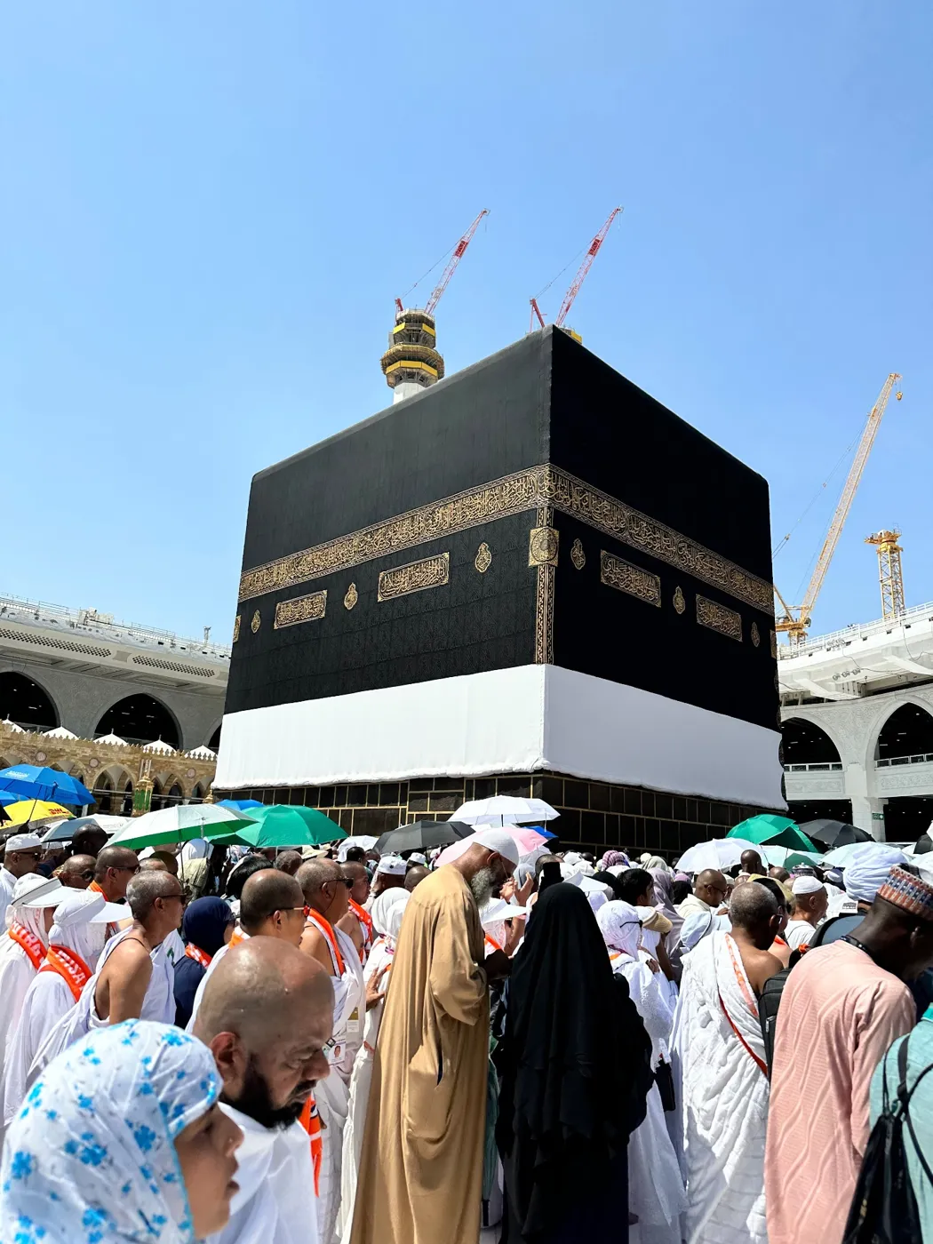 Pilgrims performing Tawaf around the Holy Kaaba under the Makkah sun